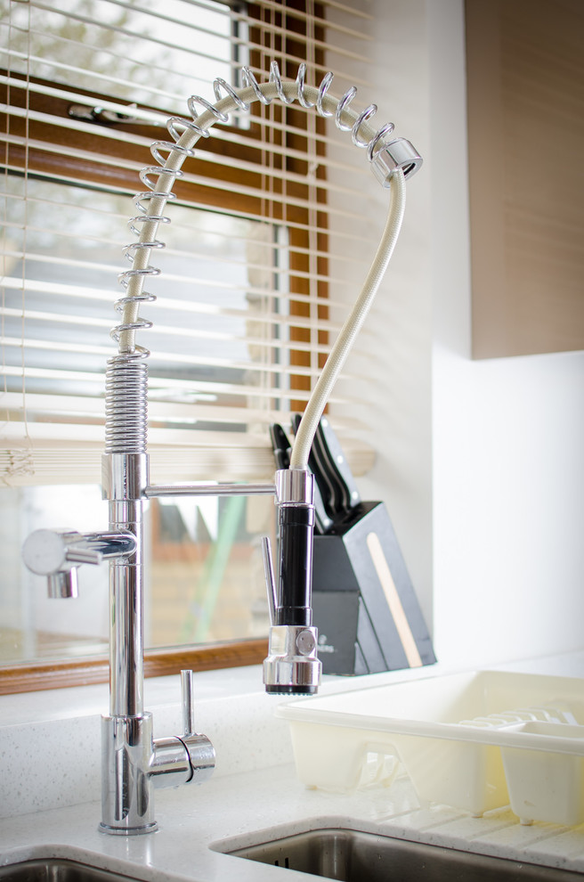 Make a spacious modern kitchen feel warm and inviting with pale coffee