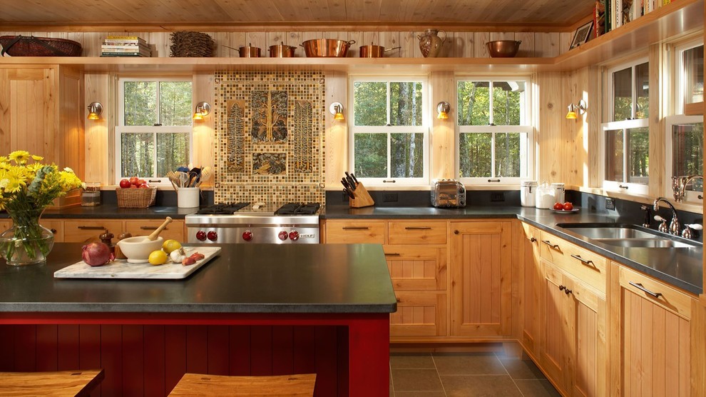 Inspiration for a mid-sized rustic l-shaped ceramic tile and gray floor enclosed kitchen remodel in Other with a double-bowl sink, beaded inset cabinets, light wood cabinets, soapstone countertops, multicolored backsplash, mosaic tile backsplash, paneled appliances and an island