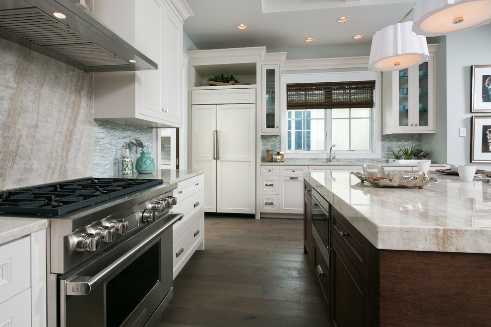 Inspiration for a medium sized coastal single-wall kitchen in Miami with shaker cabinets, white cabinets, grey splashback, matchstick tiled splashback, stainless steel appliances, dark hardwood flooring, an island and brown floors.