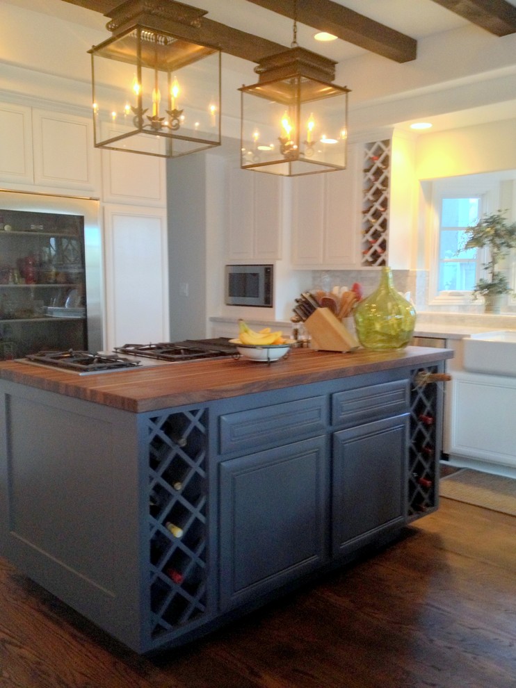 Example of a classic kitchen design in Los Angeles with gray cabinets, wood countertops and stainless steel appliances