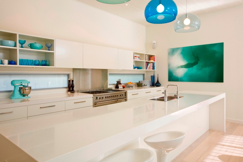 Trendy galley kitchen photo in Sydney with a double-bowl sink, flat-panel cabinets and white cabinets