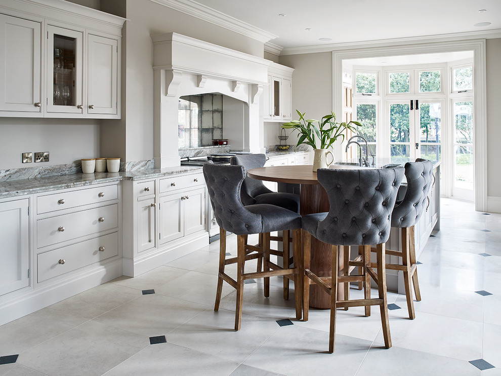Photo of a medium sized classic kitchen in Cheshire with marble worktops, mirror splashback, an island, beaded cabinets, grey cabinets and multi-coloured floors.