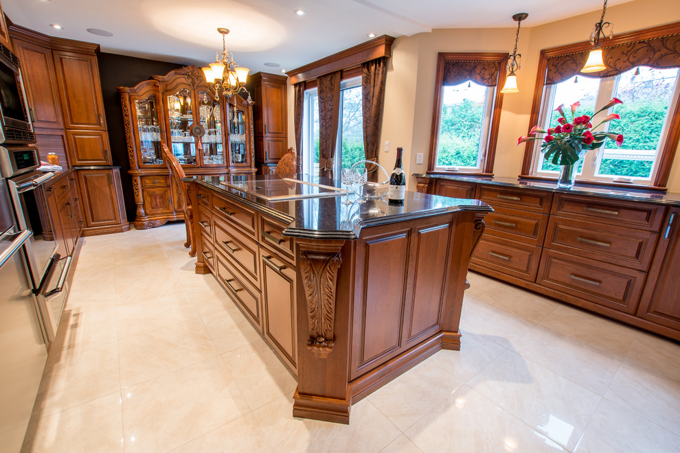 Example of a large classic u-shaped ceramic tile enclosed kitchen design in Montreal with an undermount sink, raised-panel cabinets, medium tone wood cabinets, granite countertops, black backsplash, mosaic tile backsplash, stainless steel appliances and an island