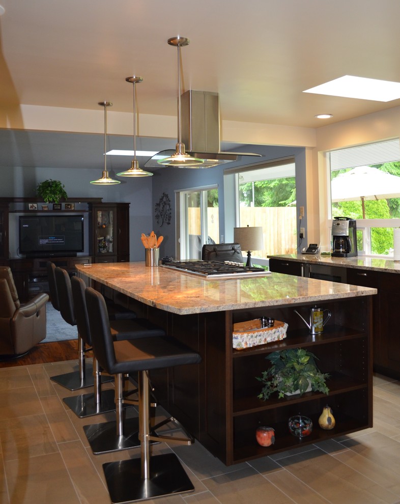 Eat-in kitchen - large transitional galley porcelain tile and beige floor eat-in kitchen idea in Seattle with an undermount sink, shaker cabinets, dark wood cabinets, granite countertops, stainless steel appliances, an island, white backsplash and glass tile backsplash