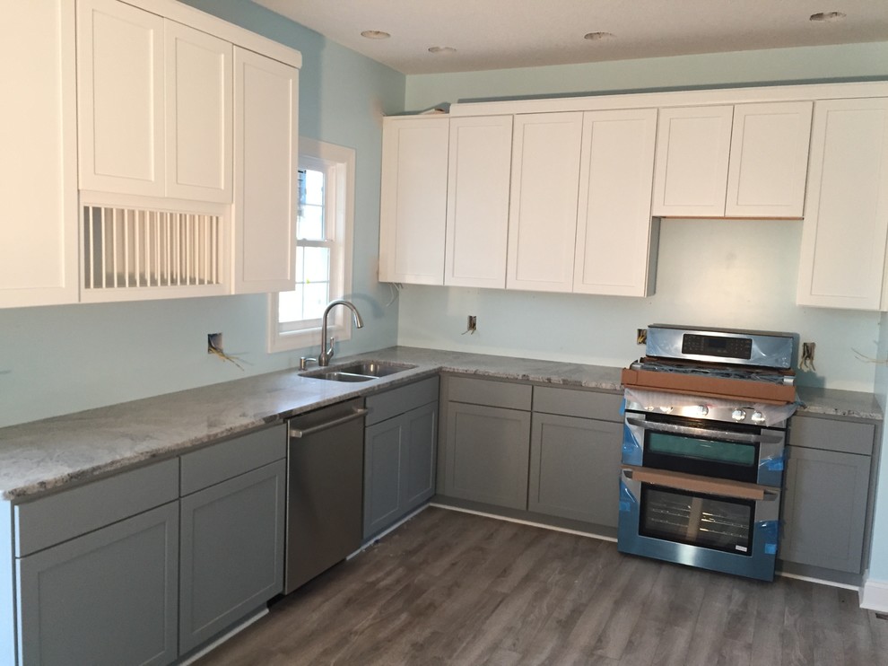 Inspiration for a medium sized coastal l-shaped kitchen/diner in Other with a submerged sink, shaker cabinets, grey cabinets, granite worktops, stainless steel appliances, light hardwood flooring and an island.