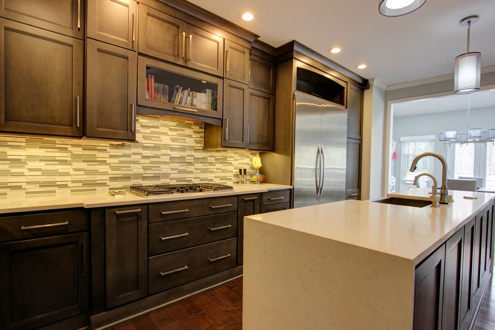 This is an example of a traditional kitchen in Atlanta with recessed-panel cabinets.