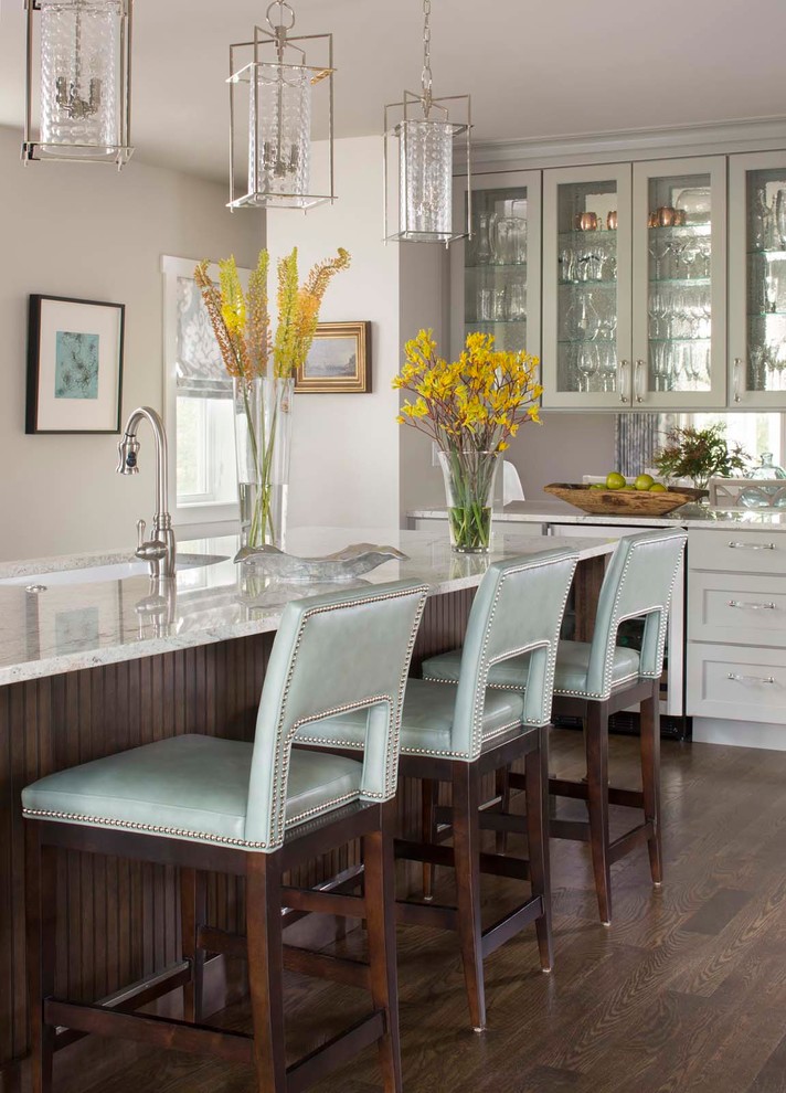 Inspiration for a classic kitchen in Denver with a submerged sink, dark hardwood flooring and an island.