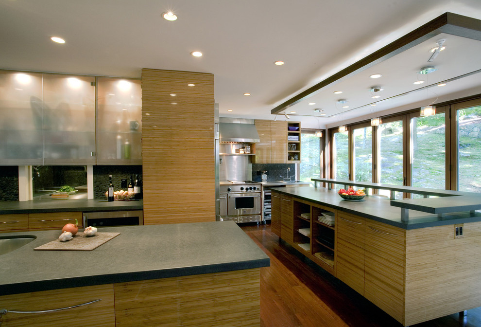 Example of a minimalist kitchen design in New York with stainless steel appliances