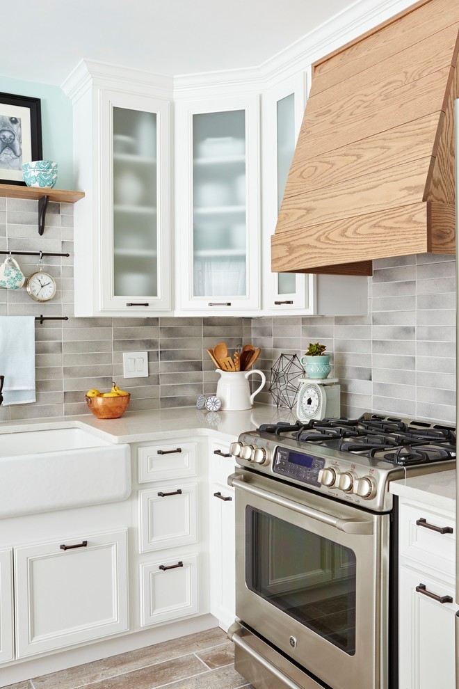 Large country u-shaped ceramic tile and beige floor eat-in kitchen photo in Other with a farmhouse sink, glass-front cabinets, yellow cabinets, quartzite countertops, gray backsplash, ceramic backsplash, stainless steel appliances, an island and white countertops