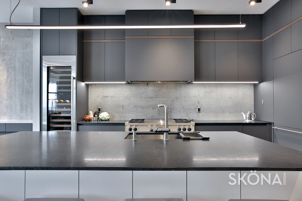 Design ideas for a medium sized contemporary l-shaped kitchen/diner in Toronto with a submerged sink, flat-panel cabinets, grey cabinets, granite worktops, grey splashback, stone slab splashback, integrated appliances, laminate floors, an island, beige floors and black worktops.