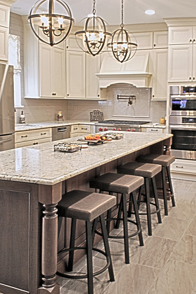 Inspiration for a large transitional u-shaped ceramic tile and gray floor open concept kitchen remodel in Philadelphia with an undermount sink, recessed-panel cabinets, distressed cabinets, granite countertops, gray backsplash, porcelain backsplash, stainless steel appliances, an island and multicolored countertops