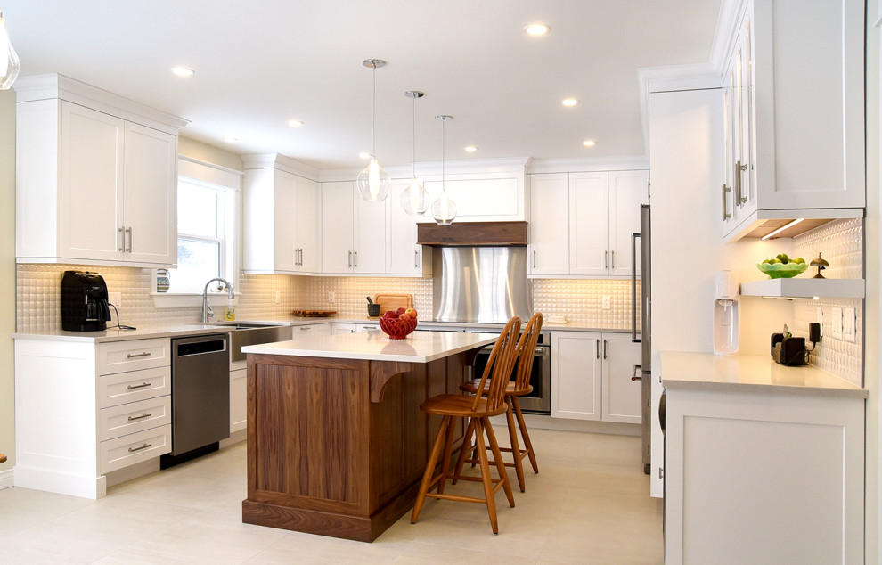 Eat-in kitchen - mid-sized transitional u-shaped ceramic tile and beige floor eat-in kitchen idea in Other with a farmhouse sink, shaker cabinets, glass countertops, beige backsplash, ceramic backsplash, stainless steel appliances, an island and white countertops