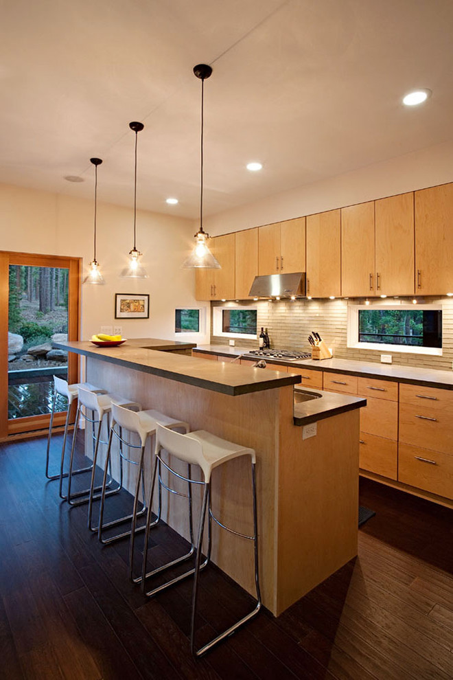Photo of a contemporary kitchen in Sacramento with matchstick tiled splashback, a submerged sink, flat-panel cabinets, medium wood cabinets, beige splashback and engineered stone countertops.