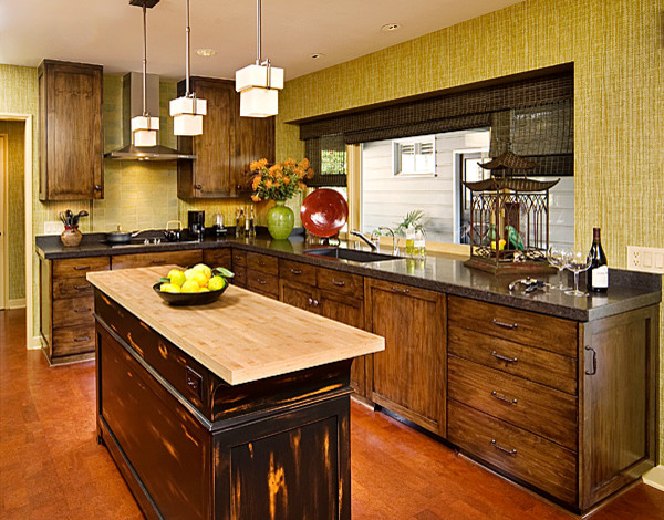 Large eclectic l-shaped kitchen in Phoenix with a submerged sink, shaker cabinets, dark wood cabinets, composite countertops, green splashback, metro tiled splashback, stainless steel appliances, dark hardwood flooring and an island.