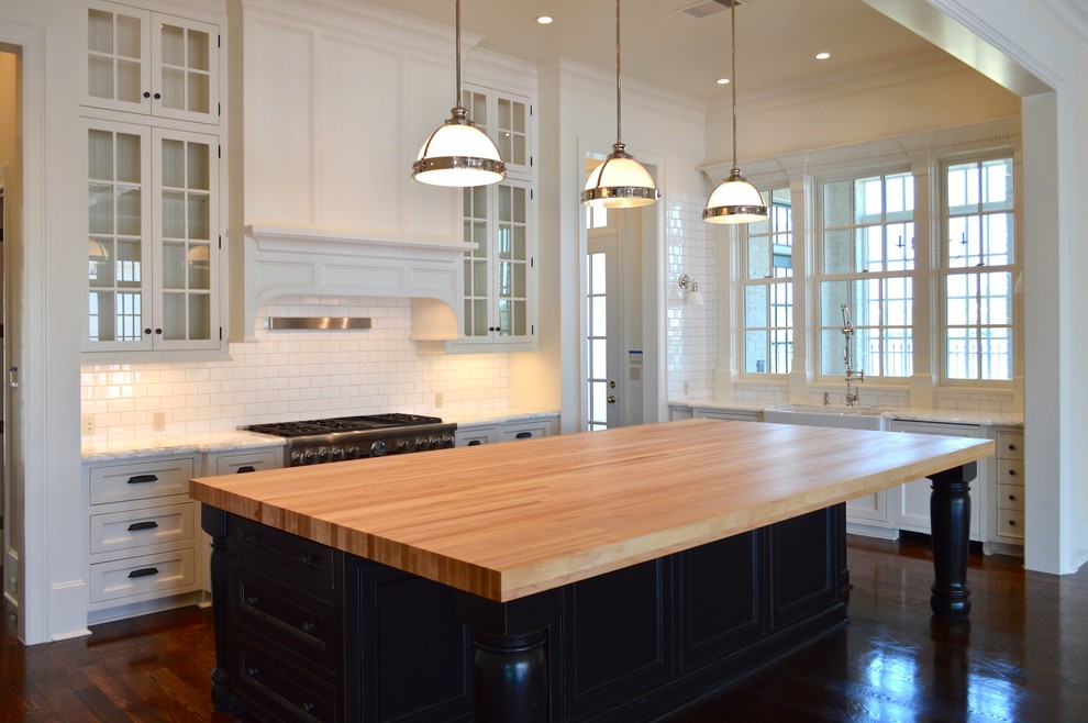 Inspiration for a large transitional u-shaped dark wood floor eat-in kitchen remodel in Houston with flat-panel cabinets, white cabinets, white backsplash and paneled appliances