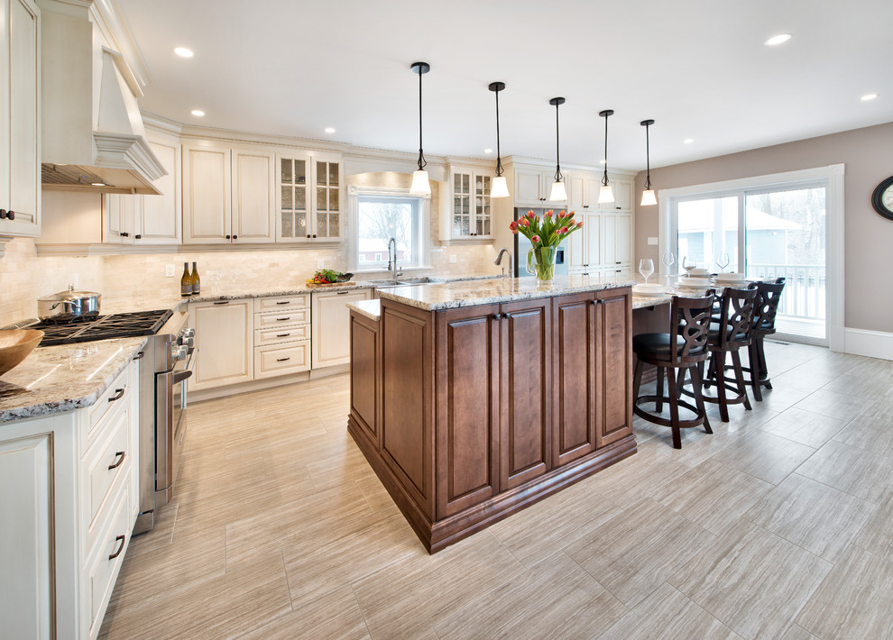 Eat-in kitchen - mid-sized traditional l-shaped light wood floor and beige floor eat-in kitchen idea in Ottawa with white cabinets, stainless steel appliances and an island