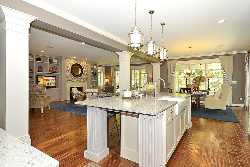 Example of a mid-sized arts and crafts l-shaped dark wood floor and brown floor eat-in kitchen design in Baltimore with a farmhouse sink, recessed-panel cabinets, gray cabinets, terrazzo countertops, white backsplash, ceramic backsplash, stainless steel appliances and an island