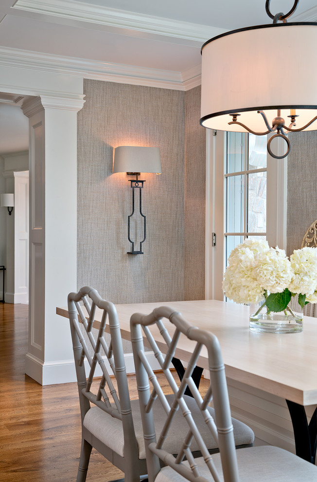 Inspiration for a traditional dining room in DC Metro with medium hardwood flooring and brown floors.