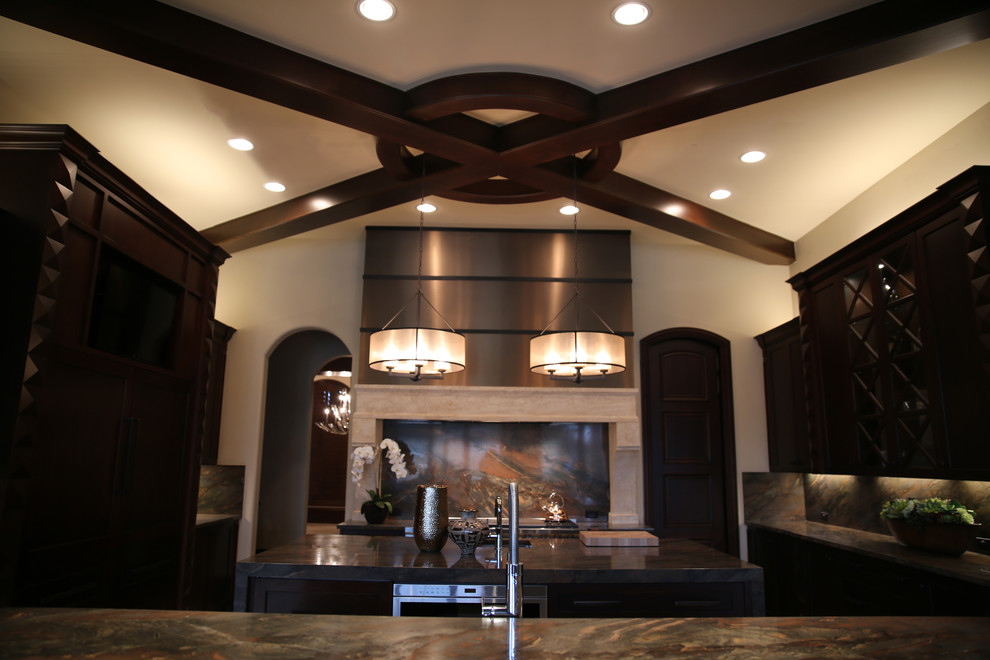 Example of a large transitional u-shaped travertine floor eat-in kitchen design in Dallas with granite countertops, black backsplash, an undermount sink, shaker cabinets, dark wood cabinets, stone slab backsplash, stainless steel appliances and an island