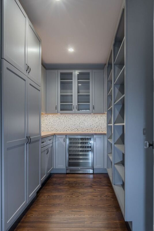 Example of a mid-sized transitional galley dark wood floor and brown floor kitchen pantry design in Boston with recessed-panel cabinets, blue cabinets, wood countertops, multicolored backsplash, mosaic tile backsplash, an island and multicolored countertops