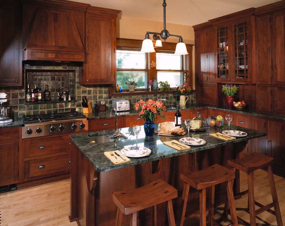 Example of a classic kitchen design in Milwaukee with stainless steel appliances