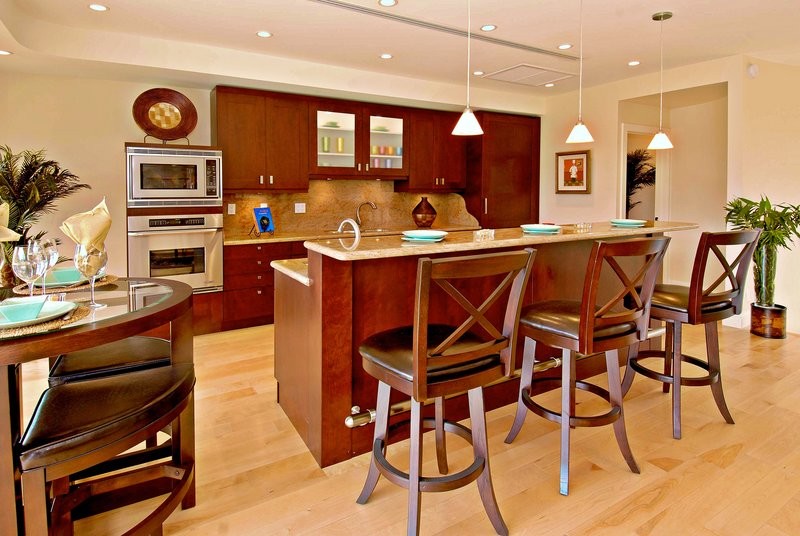 Example of an island style kitchen design in Hawaii