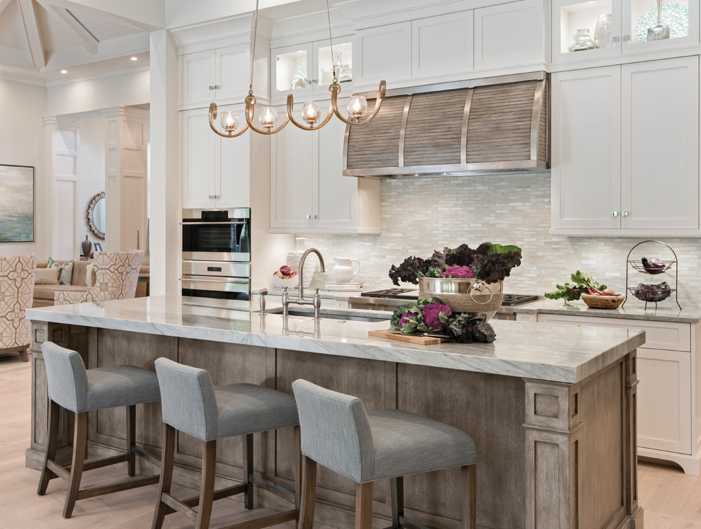 Transitional light wood floor kitchen photo in Miami with an undermount sink, shaker cabinets, white cabinets, beige backsplash and matchstick tile backsplash