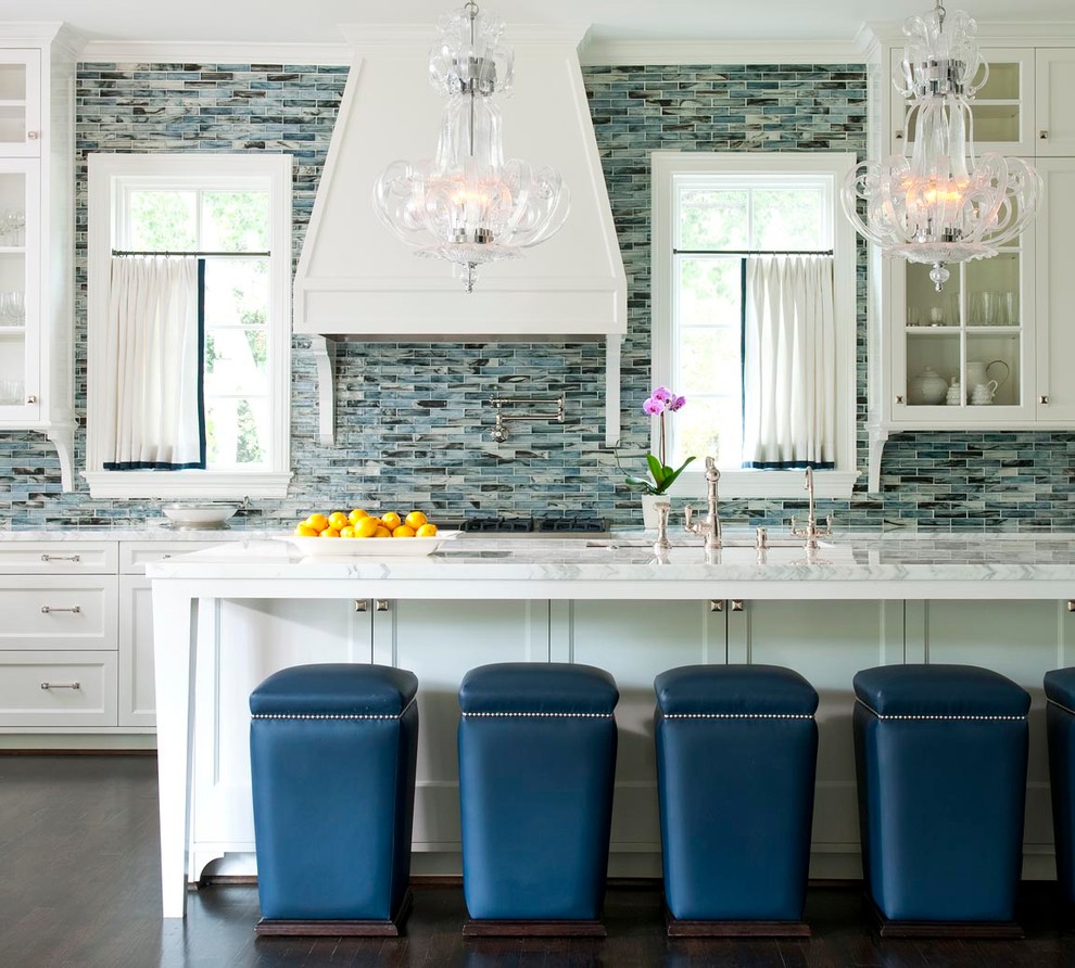 Inspiration for a traditional galley kitchen in Dallas with a submerged sink, shaker cabinets, white cabinets, blue splashback, mosaic tiled splashback, dark hardwood flooring and an island.