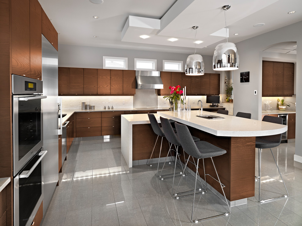 Contemporary kitchen/diner in Edmonton with flat-panel cabinets, dark wood cabinets and multiple islands.