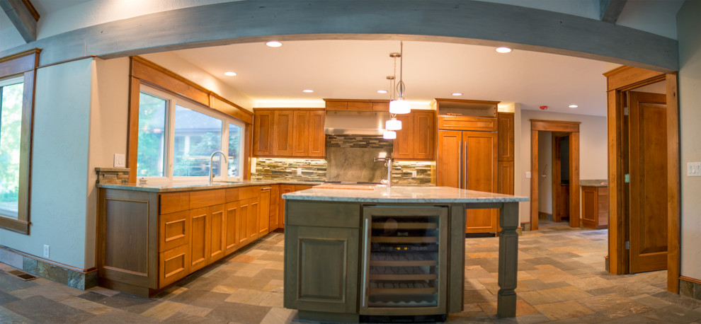Example of a large trendy l-shaped slate floor eat-in kitchen design in Other with an undermount sink, raised-panel cabinets, medium tone wood cabinets, granite countertops, multicolored backsplash, stainless steel appliances and an island