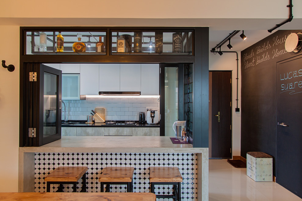 Example of a trendy kitchen design in Singapore with a drop-in sink, flat-panel cabinets, white cabinets, white backsplash and a peninsula