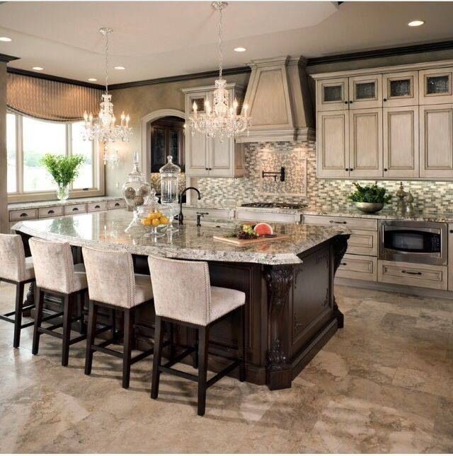 Example of a large classic l-shaped porcelain tile open concept kitchen design in Louisville with an undermount sink, raised-panel cabinets, white cabinets, granite countertops, brown backsplash, mosaic tile backsplash, stainless steel appliances and an island