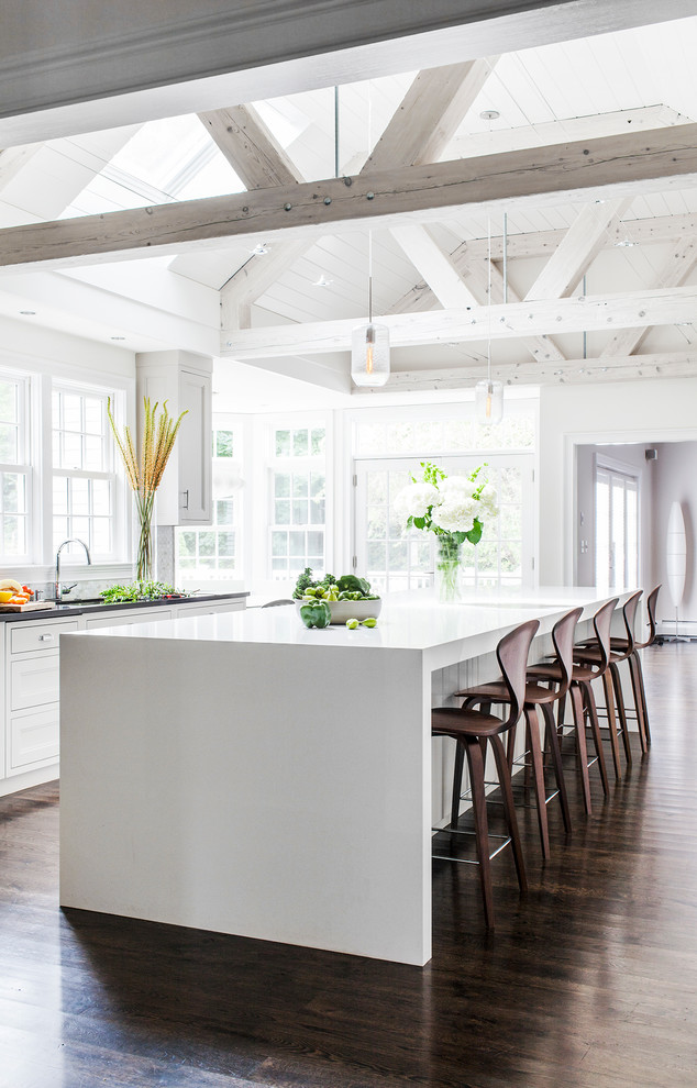 Open concept kitchen - large transitional l-shaped dark wood floor open concept kitchen idea in Boston with an undermount sink, gray cabinets, quartz countertops, gray backsplash, ceramic backsplash and stainless steel appliances