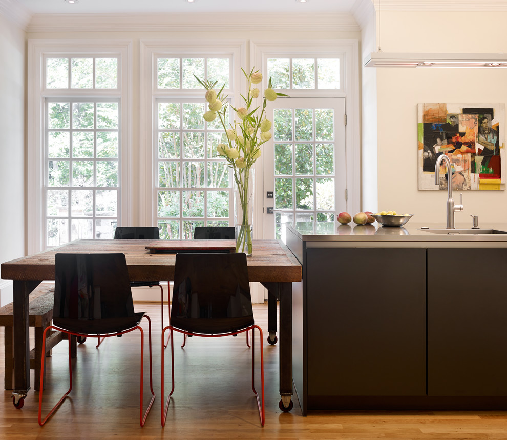 Eat-in kitchen - large contemporary l-shaped light wood floor and beige floor eat-in kitchen idea in Atlanta with an island, a single-bowl sink, shaker cabinets, white cabinets, quartz countertops, multicolored backsplash, brick backsplash, stainless steel appliances and gray countertops