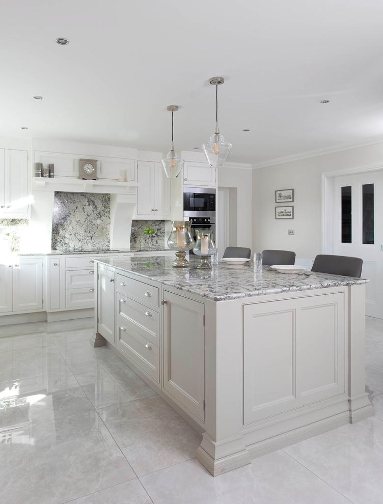 Design ideas for a large classic l-shaped kitchen/diner in Other with a submerged sink, beaded cabinets, white cabinets, granite worktops, grey splashback, stone slab splashback, stainless steel appliances, porcelain flooring, an island and grey floors.