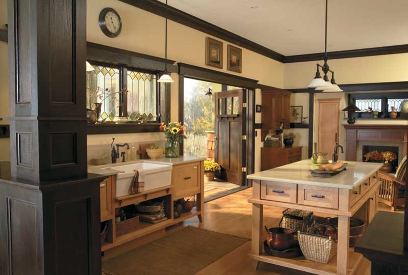 Example of a small cottage open concept kitchen design in Seattle with a farmhouse sink, shaker cabinets, light wood cabinets, solid surface countertops and an island