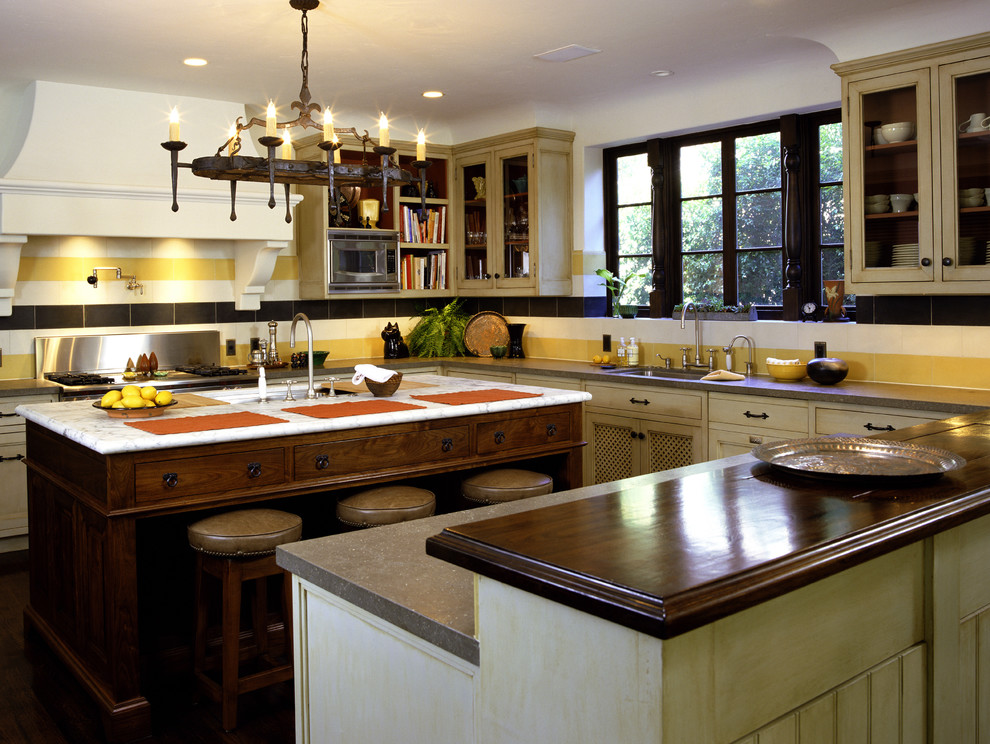 Example of a mountain style kitchen design in Los Angeles with yellow backsplash