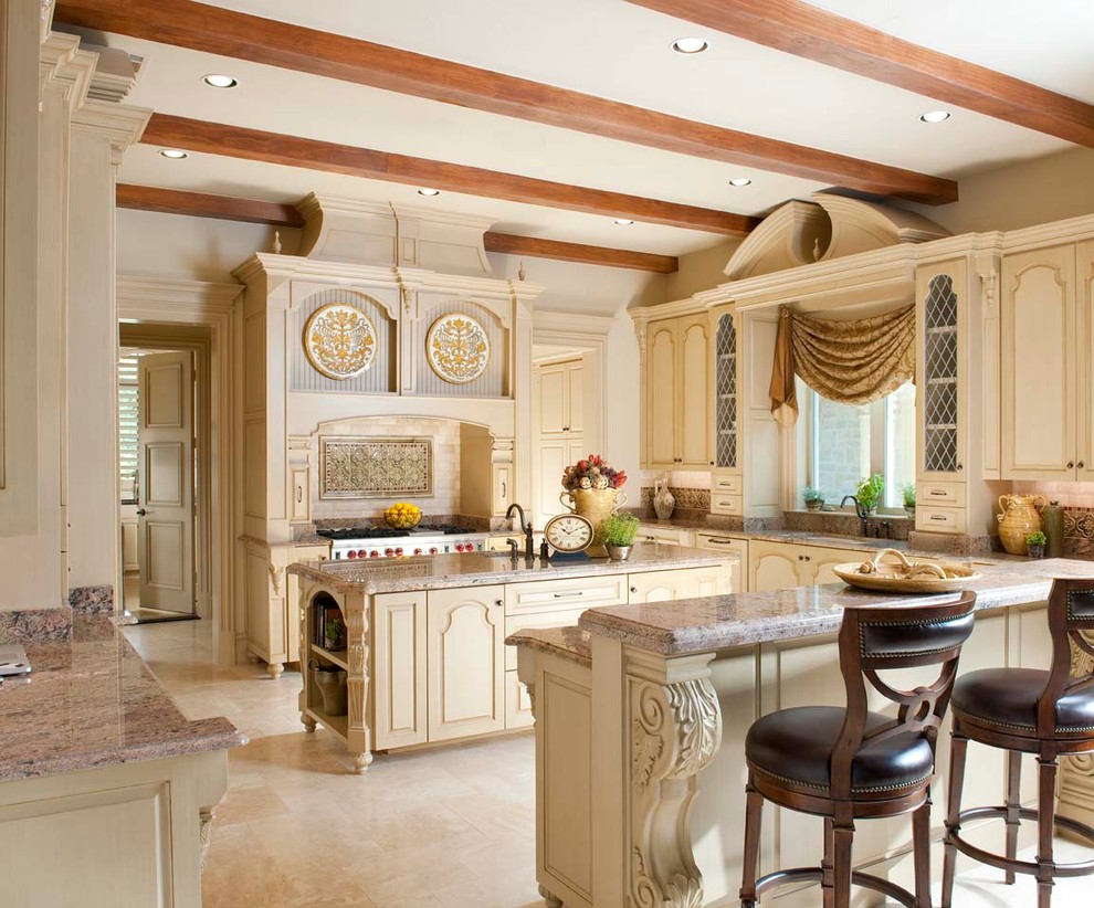 Mediterranean kitchen in Dallas with a submerged sink, raised-panel cabinets, beige cabinets and multi-coloured splashback.