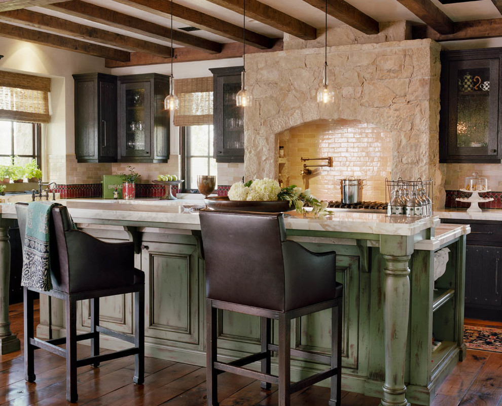 Inspiration for a mediterranean kitchen remodel in Orange County with distressed cabinets