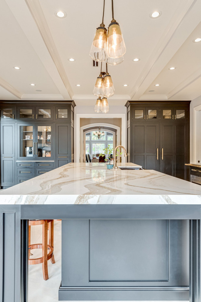 Example of a huge tuscan galley marble floor and multicolored floor eat-in kitchen design in Baltimore with a farmhouse sink, beaded inset cabinets, black cabinets, quartz countertops, beige backsplash, marble backsplash, black appliances and an island