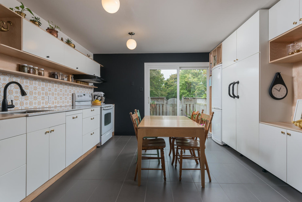 Eat-in kitchen - large scandinavian galley eat-in kitchen idea in Toronto with flat-panel cabinets and white cabinets
