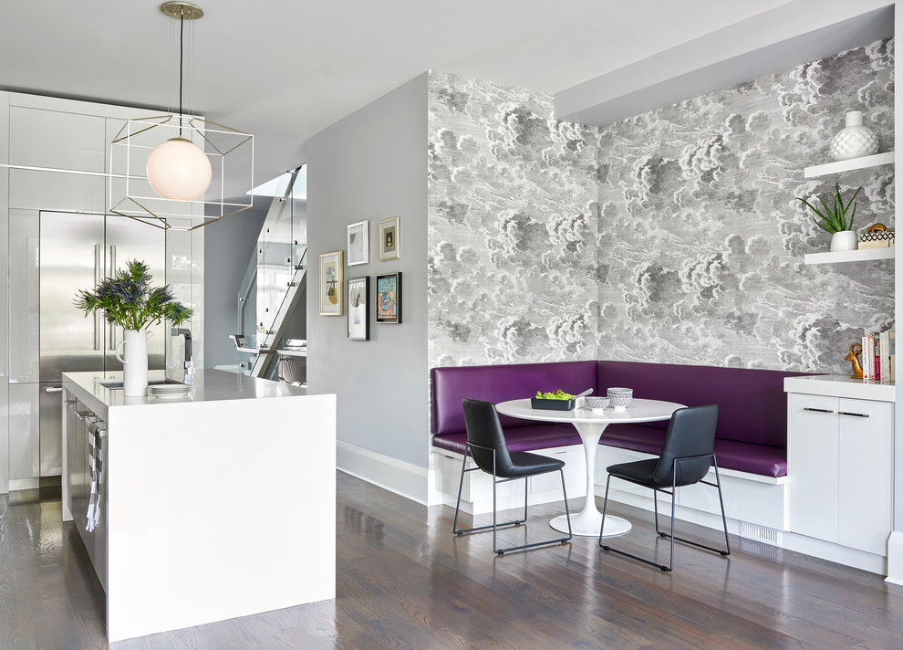 Design ideas for a contemporary grey and purple kitchen/diner in Toronto with a submerged sink, flat-panel cabinets, white cabinets, stainless steel appliances, dark hardwood flooring, an island, brown floors and white worktops.