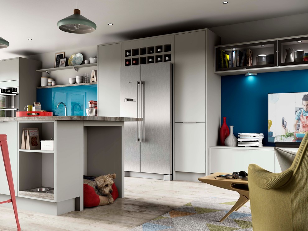 Large contemporary single-wall open plan kitchen in Other with a single-bowl sink, flat-panel cabinets, grey cabinets, wood worktops, blue splashback, glass sheet splashback, integrated appliances, light hardwood flooring, an island and beige floors.