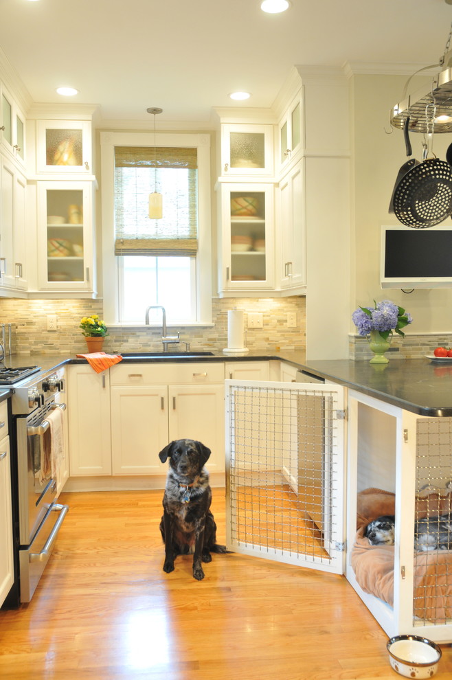 Mid-sized transitional u-shaped light wood floor and brown floor eat-in kitchen photo with an undermount sink, recessed-panel cabinets, white cabinets, gray backsplash, matchstick tile backsplash, stainless steel appliances, a peninsula, gray countertops and soapstone countertops
