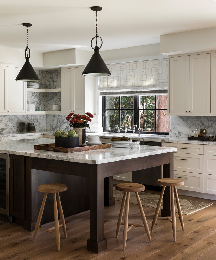 Traditional l-shaped kitchen in Seattle with shaker cabinets, beige cabinets, multi-coloured splashback, stone slab splashback, light hardwood flooring, an island and multicoloured worktops.