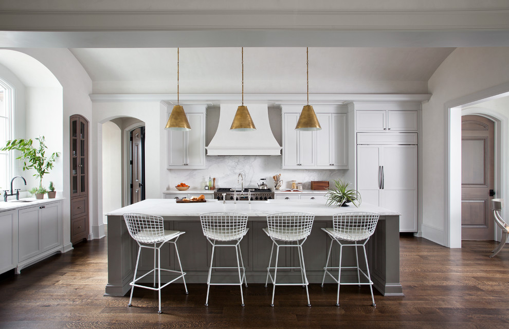 Transitional dark wood floor kitchen photo in Austin with shaker cabinets, white cabinets, white backsplash, paneled appliances and an island