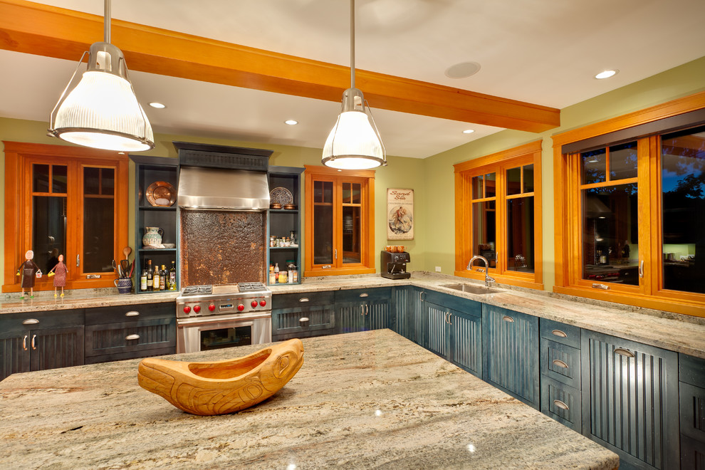 This is an example of an expansive classic u-shaped kitchen/diner in Vancouver with a submerged sink, shaker cabinets, blue cabinets, granite worktops, stainless steel appliances, light hardwood flooring, an island, orange floors and beige worktops.
