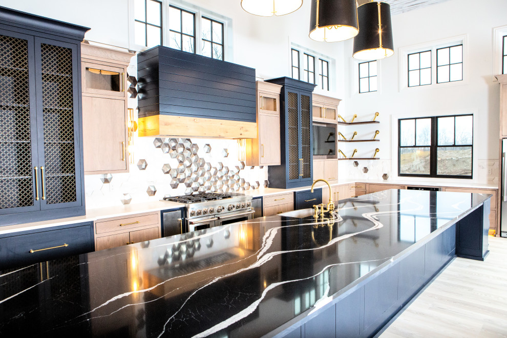 Foto di una grande cucina moderna con top in quarzo composito