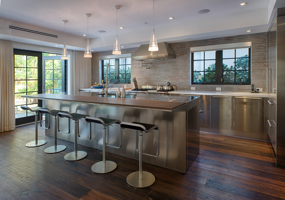 Inspiration for a mid-sized contemporary galley dark wood floor open concept kitchen remodel in Miami with an integrated sink, flat-panel cabinets, stainless steel cabinets, multicolored backsplash, stainless steel appliances and an island