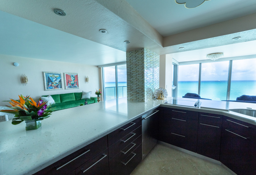Medium sized beach style open plan kitchen in Miami with a submerged sink, flat-panel cabinets, dark wood cabinets, terrazzo worktops, porcelain flooring, beige floors and multicoloured worktops.